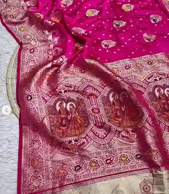 Banarasi silk saree with intricate weaving and a border featuring images of religious figures